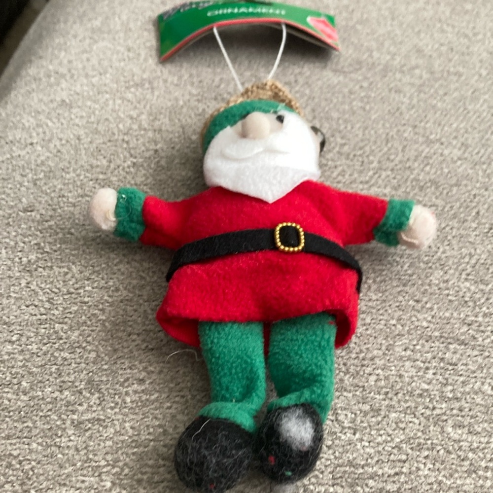 7 inch by 5.5 inch cloth Santa ornament with bell on cap